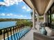 Balcony with pool and water views at 65 Lighthouse Point Dr, Longboat Key, FL 34228