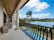 Relaxing balcony overlooking pool and waterfront views at 65 Lighthouse Point Dr, Longboat Key, FL 34228