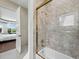 Bathroom with marble tile and gold fixtures at 65 Lighthouse Point Dr, Longboat Key, FL 34228