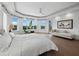 Bright bedroom with water views and hardwood floors at 65 Lighthouse Point Dr, Longboat Key, FL 34228