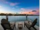 Enjoy sunset views from this waterfront dock at 65 Lighthouse Point Dr, Longboat Key, FL 34228