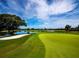 Picturesque golf course with lush greens and scenic views at 65 Lighthouse Point Dr, Longboat Key, FL 34228