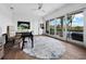 Home office with water views and hardwood floors at 65 Lighthouse Point Dr, Longboat Key, FL 34228