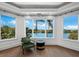 Sitting area with water views and green velvet chair at 65 Lighthouse Point Dr, Longboat Key, FL 34228