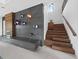 Modern staircase with dark wood and concrete wall at 65 Lighthouse Point Dr, Longboat Key, FL 34228