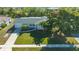 Aerial view of light green house with mature trees at 6725 Roxbury Dr, Sarasota, FL 34231