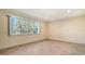 Bright bedroom with large window and tile flooring at 6725 Roxbury Dr, Sarasota, FL 34231