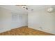 Spacious bedroom with wood-look flooring and large closet at 6725 Roxbury Dr, Sarasota, FL 34231