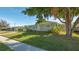 Ranch style home with green exterior and landscaping at 6725 Roxbury Dr, Sarasota, FL 34231