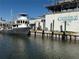 Commercial fishing boat docked next to a seafood building at 11907 45Th W Ave, Cortez, FL 34215