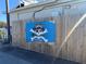 Cortez Kitchen sign on a wooden fence at 11907 45Th W Ave, Cortez, FL 34215