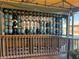 Swordfish Grill sign made of buoys; wooden railing and table at 4420 119Th W St, Cortez, FL 34215