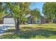 Gray house with a two-car garage and a well-maintained lawn at 4905 22Nd E Ct, Bradenton, FL 34203