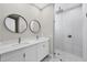 Bathroom with double vanity, frameless shower, and modern fixtures at 14065 Paris Ln, Port Charlotte, FL 33981