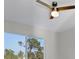 Bright bedroom with ceiling fan and large window at 14065 Paris Ln, Port Charlotte, FL 33981