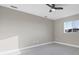 Simple bedroom with ceiling fan and window at 14065 Paris Ln, Port Charlotte, FL 33981