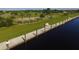 Aerial view of a waterfront walkway and dock at 14065 Paris Ln, Port Charlotte, FL 33981