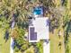 Aerial view of home with solar panels and pool at 2910 49Th St, Sarasota, FL 34234