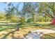 Landscaped backyard with a walkway leading to the house at 2910 49Th St, Sarasota, FL 34234