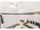 Clean bathroom with white subway tiles and hexagon floor tiles at 2910 49Th St, Sarasota, FL 34234