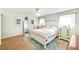 Bright bedroom with a white bed frame and wood flooring at 2910 49Th St, Sarasota, FL 34234