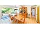 Dining area with wood table and hutch, leading to the patio at 2910 49Th St, Sarasota, FL 34234