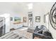 Relaxing living room with gray sofa and large TV at 2910 49Th St, Sarasota, FL 34234