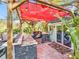 Outdoor kitchen with granite countertop and stainless steel appliances at 2910 49Th St, Sarasota, FL 34234