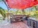 Outdoor kitchen with granite countertop and wine cooler at 2910 49Th St, Sarasota, FL 34234