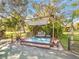 Outdoor seating area under a shaded pergola at 2910 49Th St, Sarasota, FL 34234