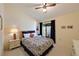 Spacious bedroom with a ceiling fan and sliding door access at 2915 Oak Ln, Bradenton, FL 34209