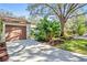 Attached garage with ample storage shelving and workbench at 2915 Oak Ln, Bradenton, FL 34209