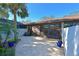 Private patio with brick pavers and tropical plants at 2915 Oak Ln, Bradenton, FL 34209