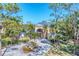 Luxury waterfront home with circular driveway and fountain at 6779 Ashley Ct, Sarasota, FL 34241