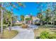 Two-story house with landscaped yard and circular drive at 6779 Ashley Ct, Sarasota, FL 34241