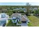 Modern two-story house with a large yard and paved driveway, seen from above at 901 30Th E Ct, Bradenton, FL 34208