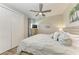 King-size bedroom with ceiling fan, TV, and ample closet space at 901 30Th E Ct, Bradenton, FL 34208