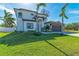 Two-story home with modern design, paved driveway, and lush landscaping at 901 30Th E Ct, Bradenton, FL 34208