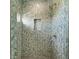 Elegant herringbone tile shower with glass enclosure at 901 30Th E Ct, Bradenton, FL 34208