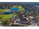 Aerial view of community clubhouse near golf course and residential homes at 9908 Carnoustie Pl, Bradenton, FL 34211