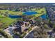 Aerial view of community clubhouse near golf course and residential homes at 9908 Carnoustie Pl, Bradenton, FL 34211