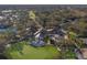 Aerial view of community clubhouse, pool, tennis courts, and golf course at 9908 Carnoustie Pl, Bradenton, FL 34211