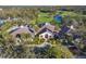 Aerial view of clubhouse with golf course and pond at 9908 Carnoustie Pl, Bradenton, FL 34211