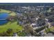 Aerial view of community clubhouse near golf course and residential homes at 9908 Carnoustie Pl, Bradenton, FL 34211