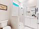 Clean bathroom with a walk-in shower and white vanity at 9908 Carnoustie Pl, Bradenton, FL 34211