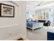 Main bedroom with sitting area and white sleigh bed at 9908 Carnoustie Pl, Bradenton, FL 34211