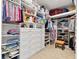 Large walk-in closet with ample shelving and drawers at 9908 Carnoustie Pl, Bradenton, FL 34211