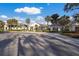 Clubhouse exterior view with palm trees and landscaping at 9908 Carnoustie Pl, Bradenton, FL 34211