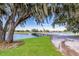 Serene golf course view with a wooden bridge and lush foliage at 9908 Carnoustie Pl, Bradenton, FL 34211