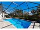 Refreshing pool with screened enclosure and ample deck space at 9908 Carnoustie Pl, Bradenton, FL 34211